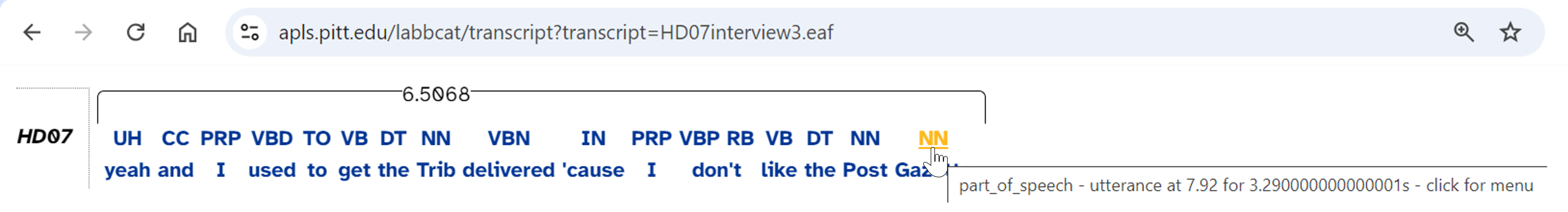 A partial screenshot from Google Chrome (as it appeared in 2024), showing the page https://apls.pitt.edu/labbcat/transcript?transcript=HD07interview3.eaf and a single line of dialogue from participant HD07. Three lines of information are shown. The first is a black bracket encompassing the entire line with the label "6.5068"; the second shows symbols "UH CC PRP VBD TO VB DT NN VBN IN PRP VBP RB VB DT NN NN"; and the third shows "yeah and I used to get the Trib delivered 'cause I don't like the Post Gazette". At the end of the second line, a cursor is hovering over the text "NN" with a tooltip "part_of_speech - utterance at 7.92 for 3.2900000000000001s - click for menu"